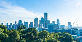 Beautiful architecture building exterior cityscape in Singapore city skyline with white cloud on blue sky