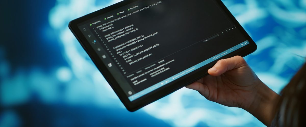 Close up of IT professional using tablet, building AI algorithms Software developer with tablet programming artificial intelligence computing simulating human brain. Close up of IT professional using device, building AI machine learning algorithms, camera A