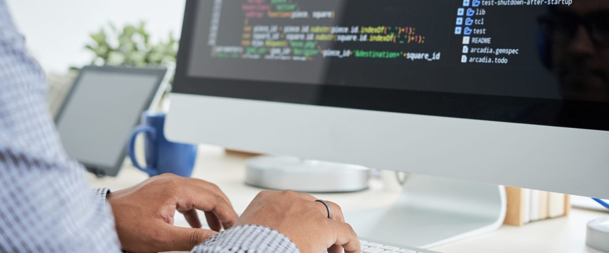 Coding man Cropped image of It specialist working on code