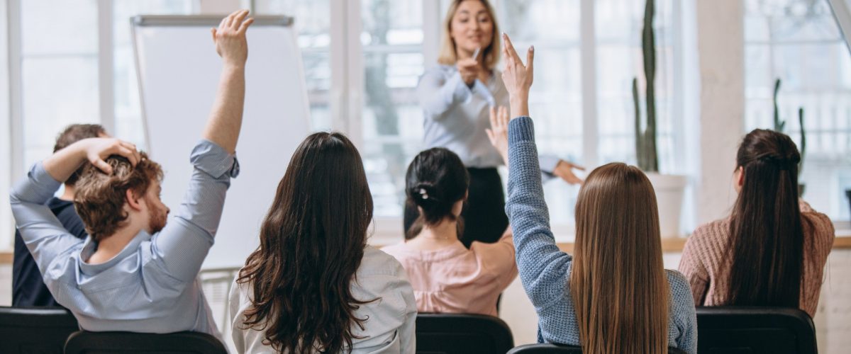 female-speaker-giving-presentation-hall-university-workshop-audience-conference-hall