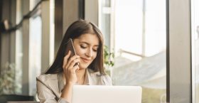 freelance-woman-working-with-laptop-coffee-shop