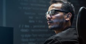 Man analysing binary code on virtual screen Man analysing binary code on virtual screen