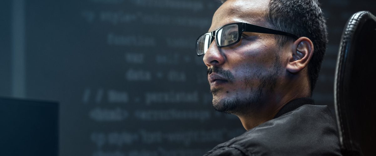 Man analysing binary code on virtual screen Man analysing binary code on virtual screen