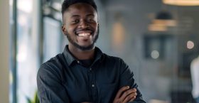 man-with-watch-his-left-arm-is-smiling