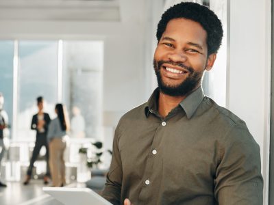 Portrait, digital tablet and black man in office happy, smile and empowered, ambition and mindset. Face and business man or ceo at startup company for management or online project at workplace.