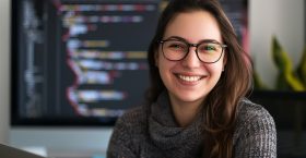 portrait-young-female-it-specialist-office-wearing-ash-color-kit