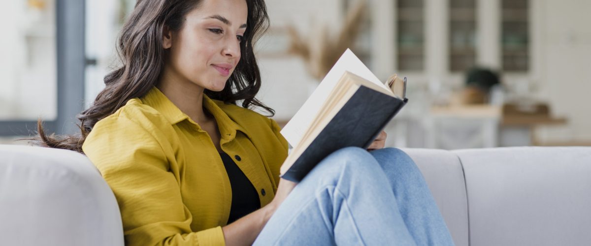 side-view-woman-reading-indoors