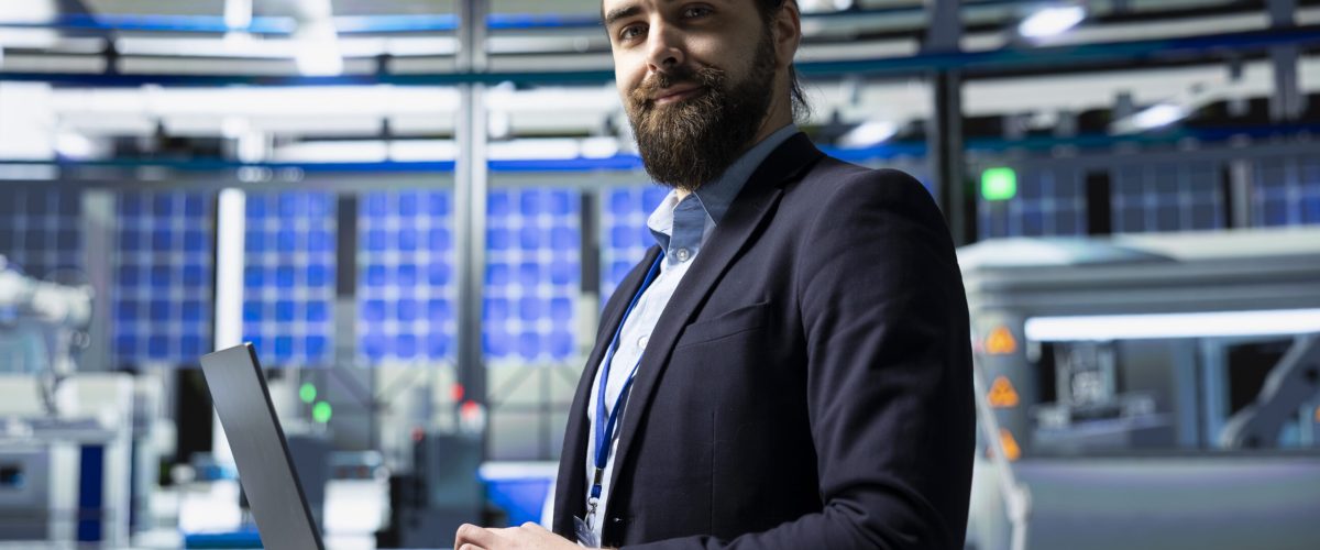 Solar panel industry expert stands in a high tech facility for inspection, quality control production metrics. Professional consultant ensuring industrial operations for innovation.