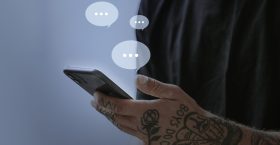 Tattooed man texting for social media remix Tattooed man texting for social media remix