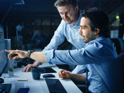 two-men-working-computer-with-watch-screen