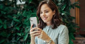 woman-using-smartphone-with-pop-socket