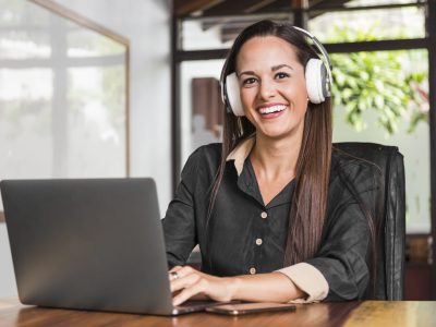 woman-wearing-headphones-looking-camera