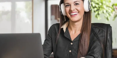 woman-wearing-headphones-looking-camera-scaled-r01yln1qc62wbmg3fkss5k7gxhxm85qax9ze7447m0.jpg