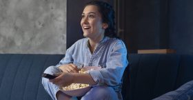 young-woman-watching-streaming-service-home