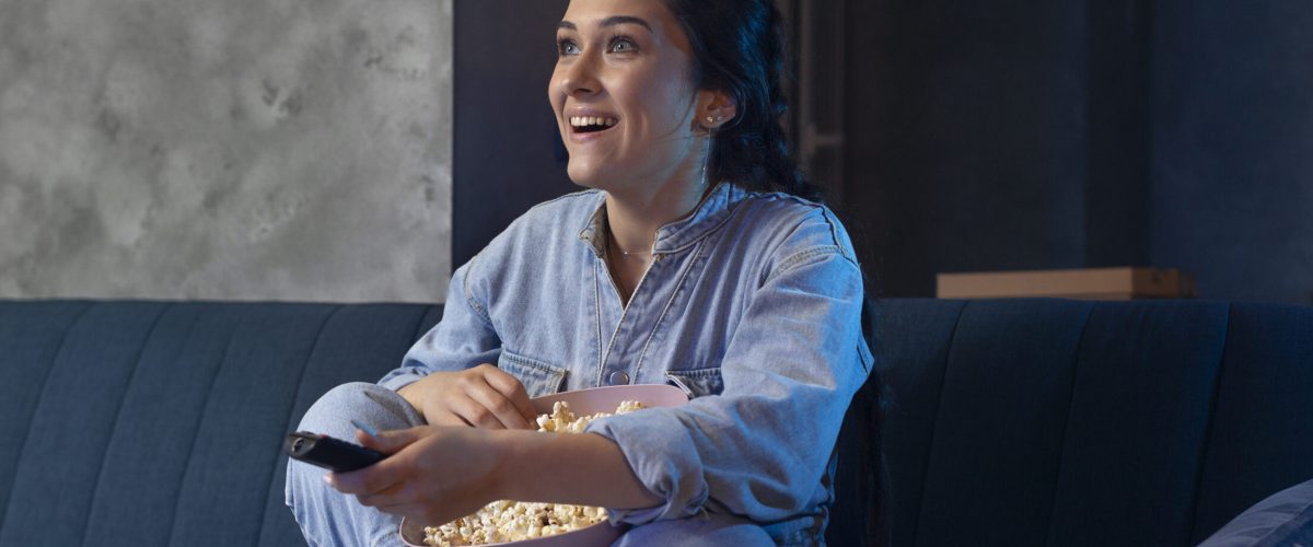 young-woman-watching-streaming-service-home